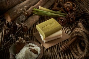 a stack of soaps on a woody background
